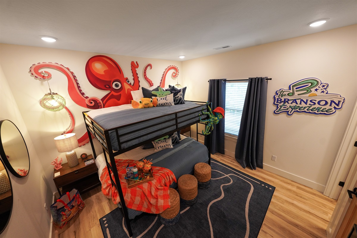 The Aquarium room will be a hit with kids of all ages. Even the kids at heart. Queen over queen bunks