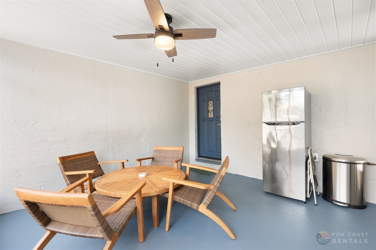 Outdoor Lanai area with lounge seating and outdoor fridge