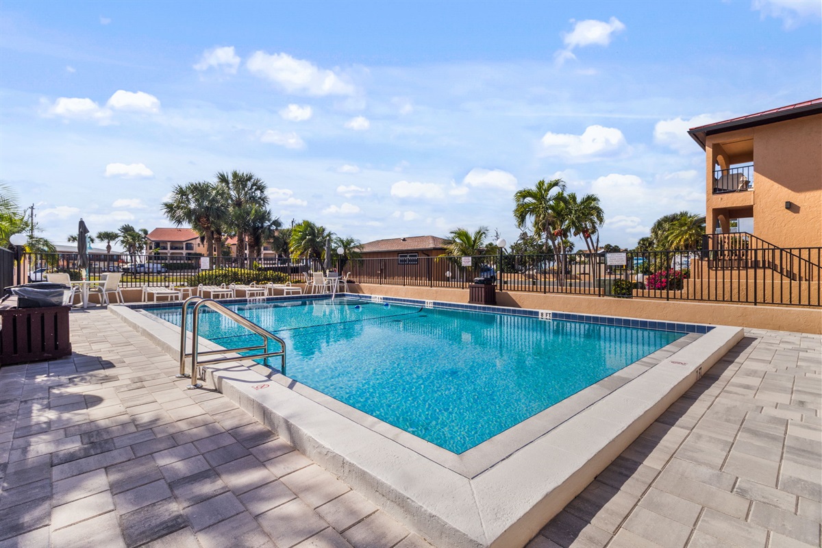 Heated pool is just steps away from the unit.