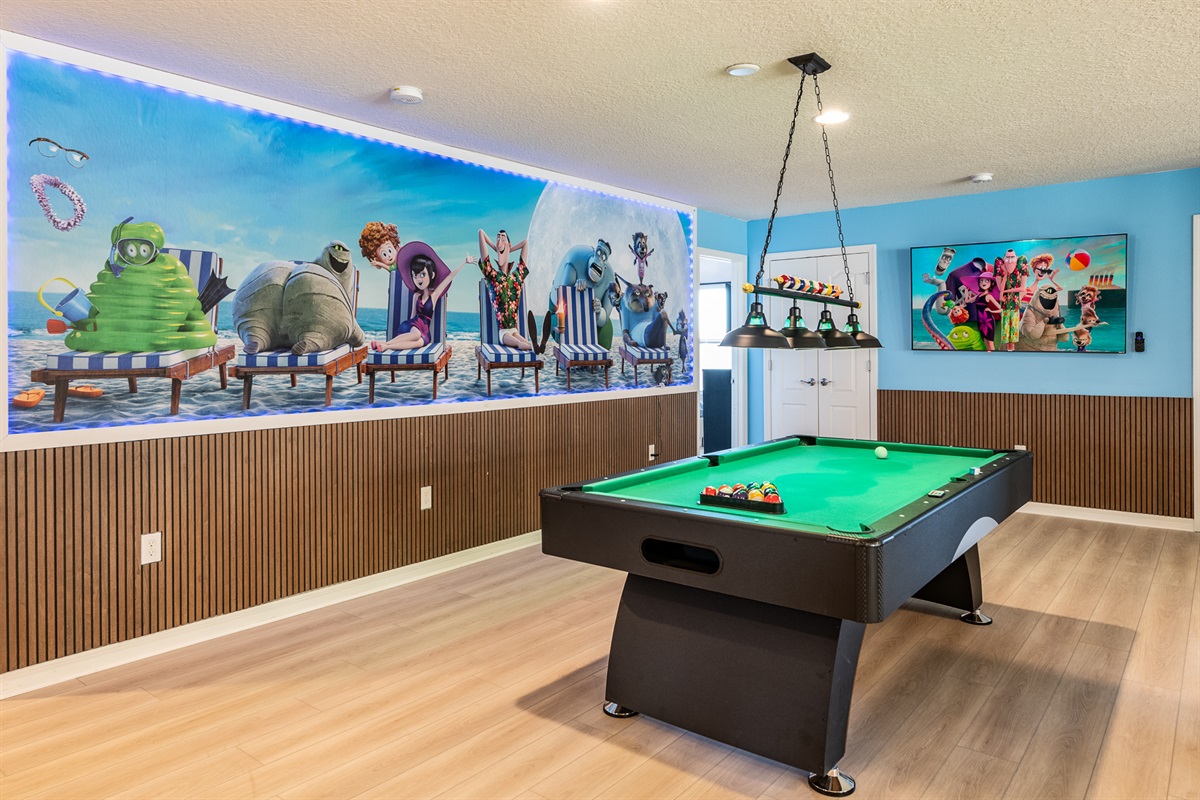 Hotel Transylvania themed loft has games galore, including a pool table and tv for watching your favorite game