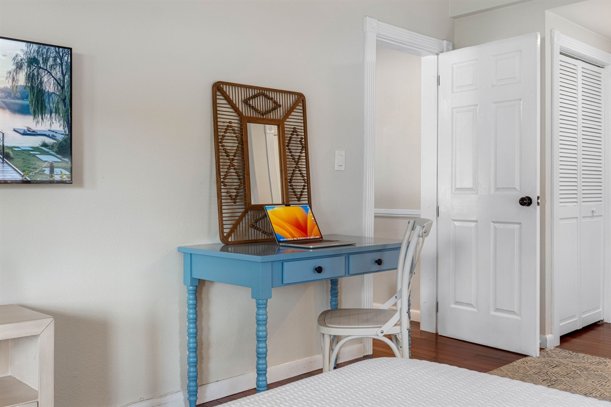 A welcoming retreat with a charming work nook complete with a desk and chair.