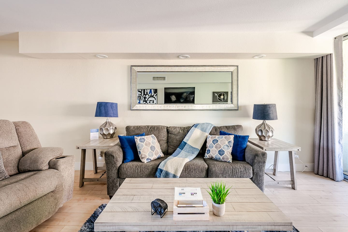 Relaxing living room includes queen sleeper sofa with memory foam mattress.