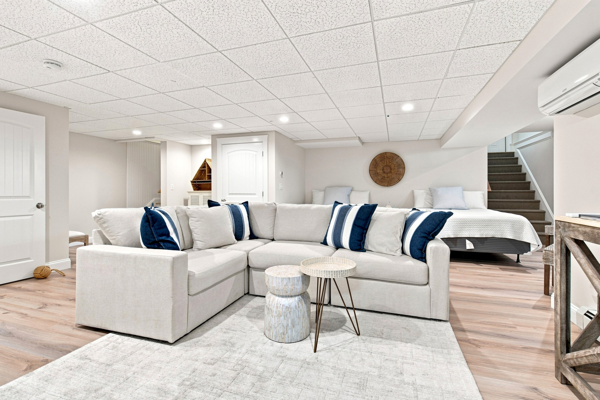 A spacious sectional and open layout make this lower-level lounge an ideal gathering spot for the group.