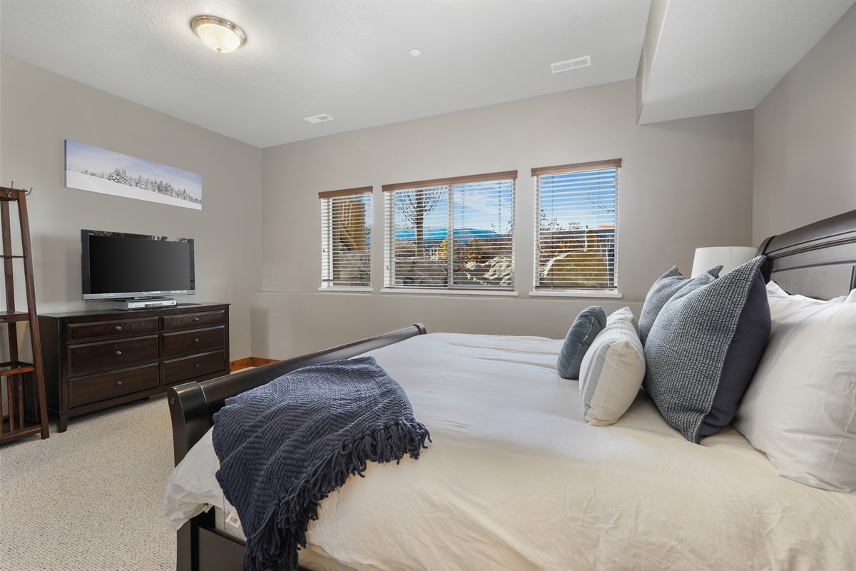 Stretch out and relax—this bedroom offers space, comfort, and a place to recharge.