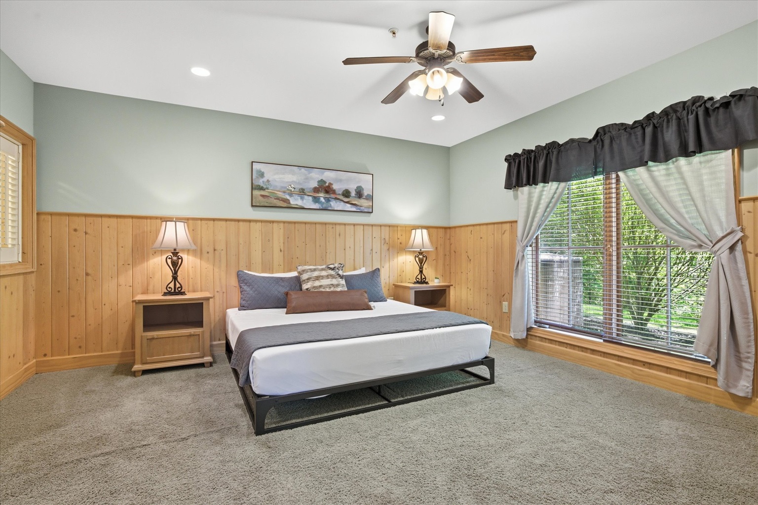 Settle into the spacious master king bedroom with easy access, a cozy cabin feel, and a private ensuite bathroom just steps away.