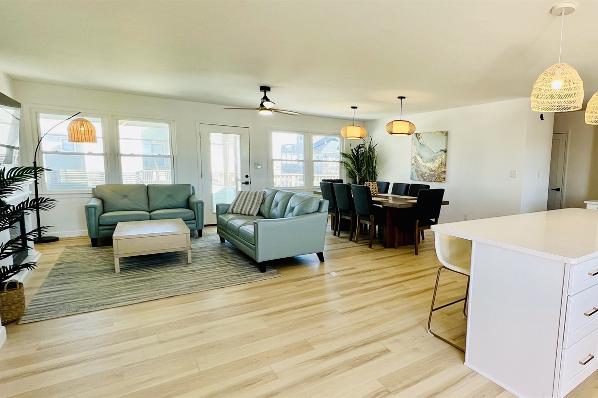 A wall of windows adds tons of natural light to the open floor plan