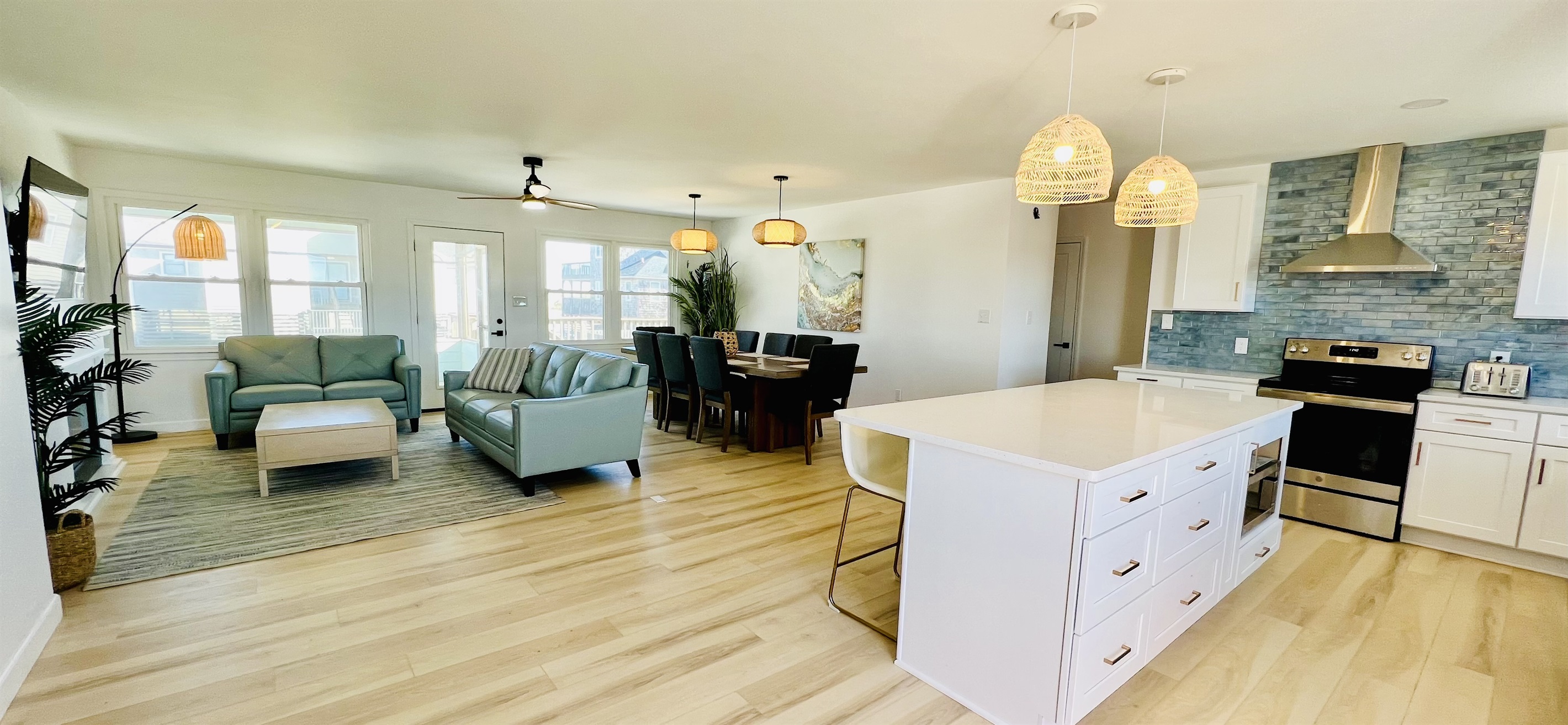 A wall of windows adds tons of natural light to the open floor plan