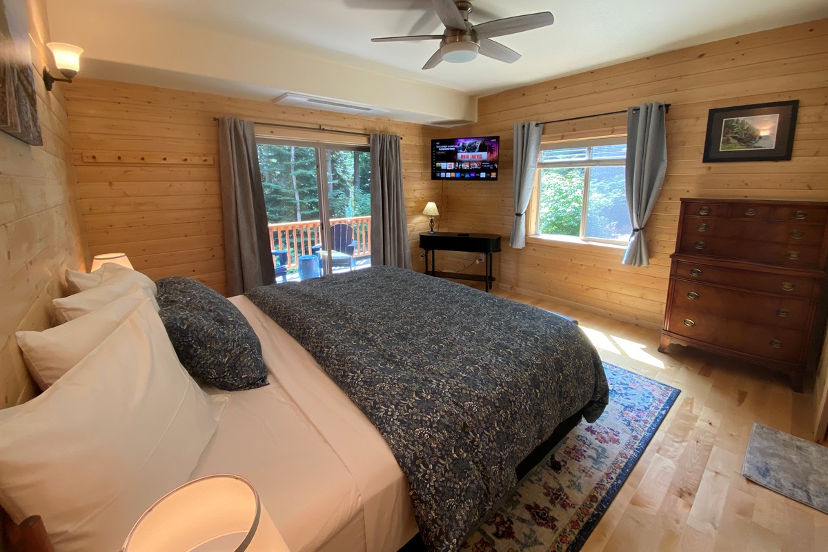 Comfy king-sized bed with slider leading out to your deck.  Private television with Roku is nice for late-night movies in bed.