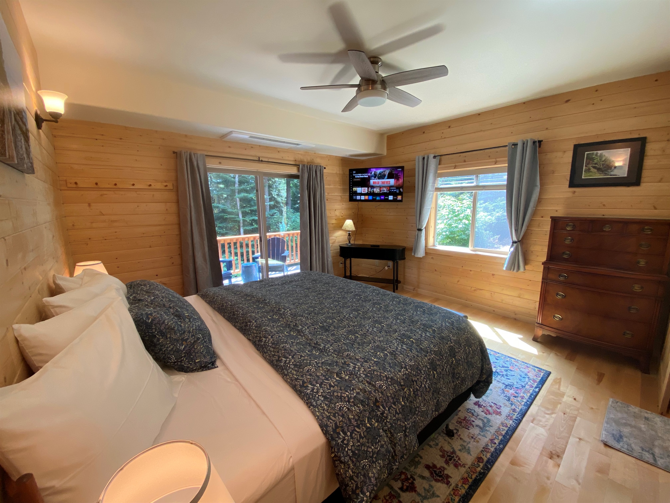 Comfy king-sized bed with slider leading out to your deck.  Private television with Roku is nice for late-night movies in bed.