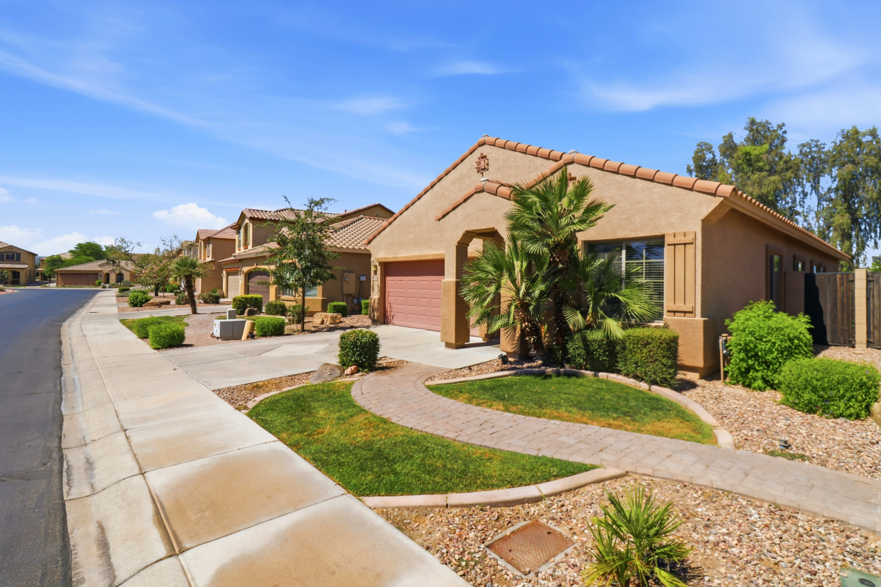 Front exterior with driveway parking, a private entrance, and a clean walkway to the home.
