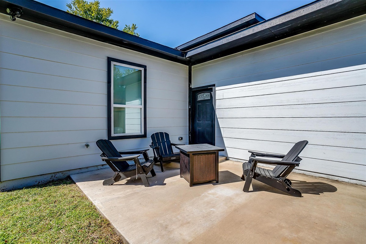 Backyard seating area with firepit—great for relaxing evenings.