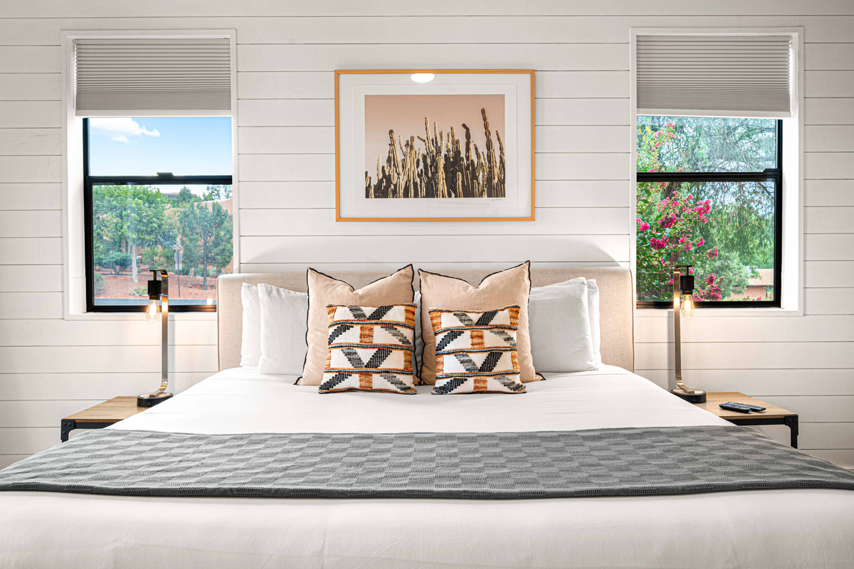 {Bedroom 1} Retreat to a luxurious king bed in this bright, serene suite with its own private spa-inspired ensuite bath.