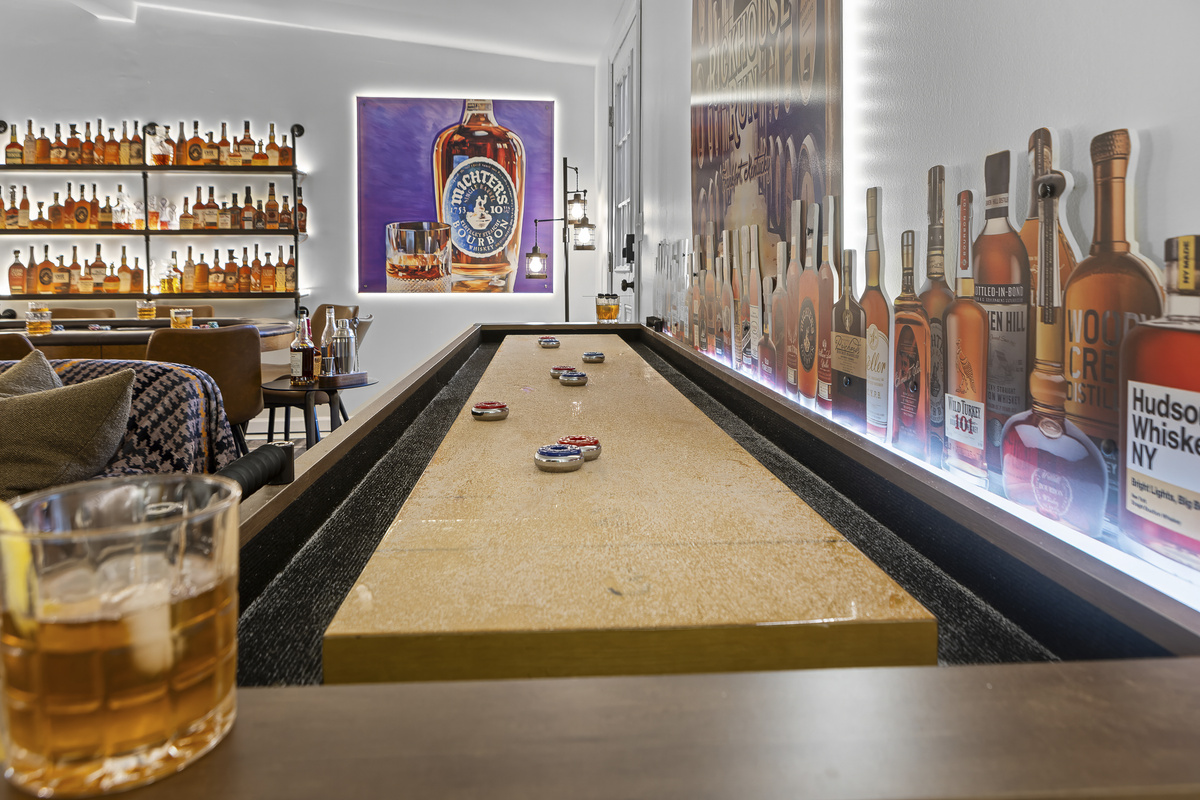 Challenge the crew to a game on the full-length shuffleboard table, with a glass of bourbon never far from reach.