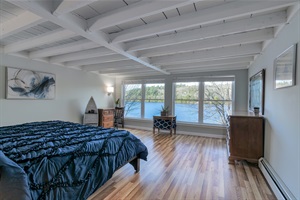 King bedroom with huge lake window views