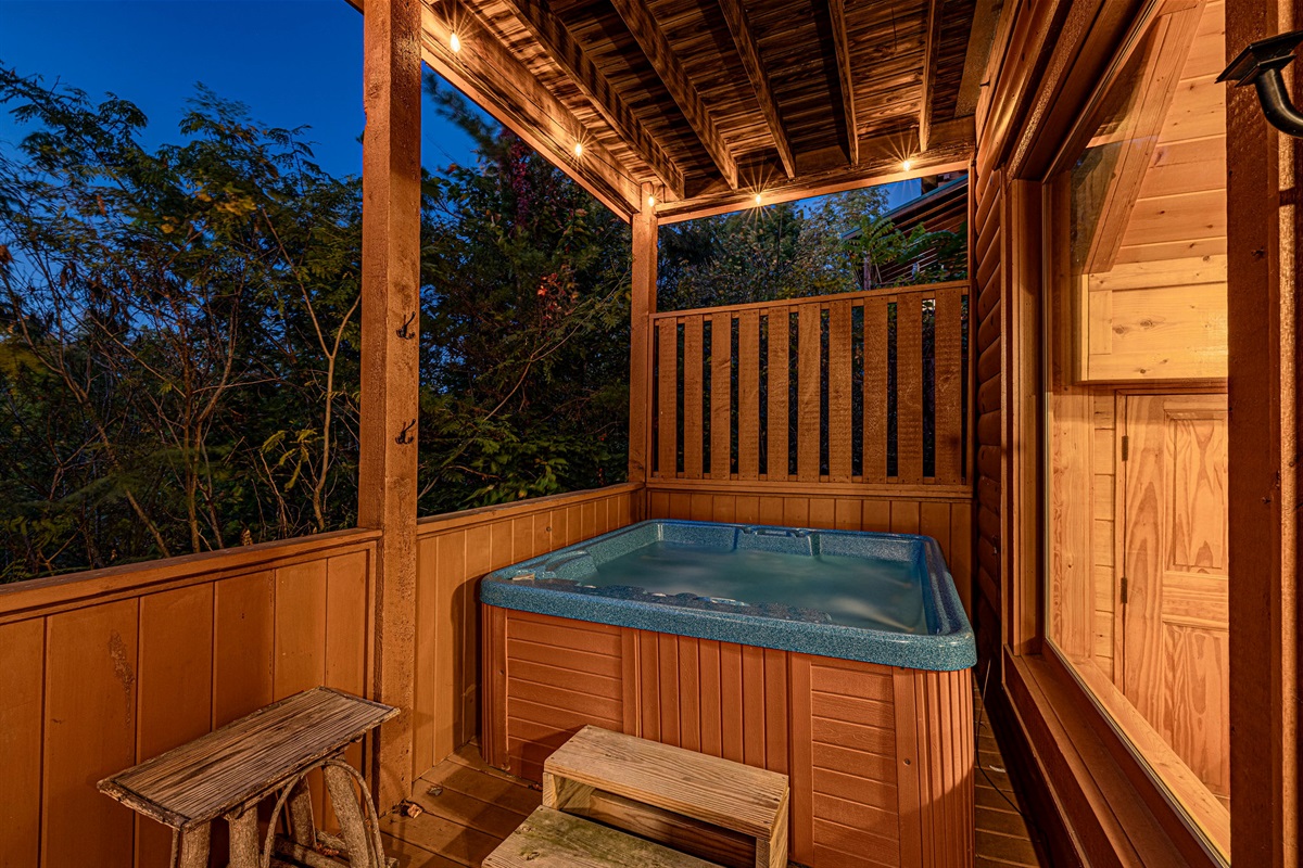 What's better than relaxing in a private hot tub while staying at a cabin in the mountains? The hot tub is located on the lower back deck with privacy screen.