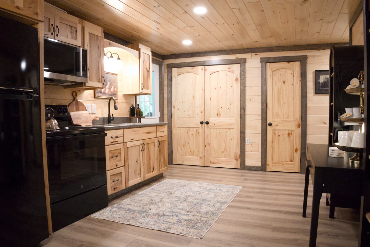 Kitchen. Full Stove, Refrigerator and Well Stocked. Laundry is inside the double doors, for your use