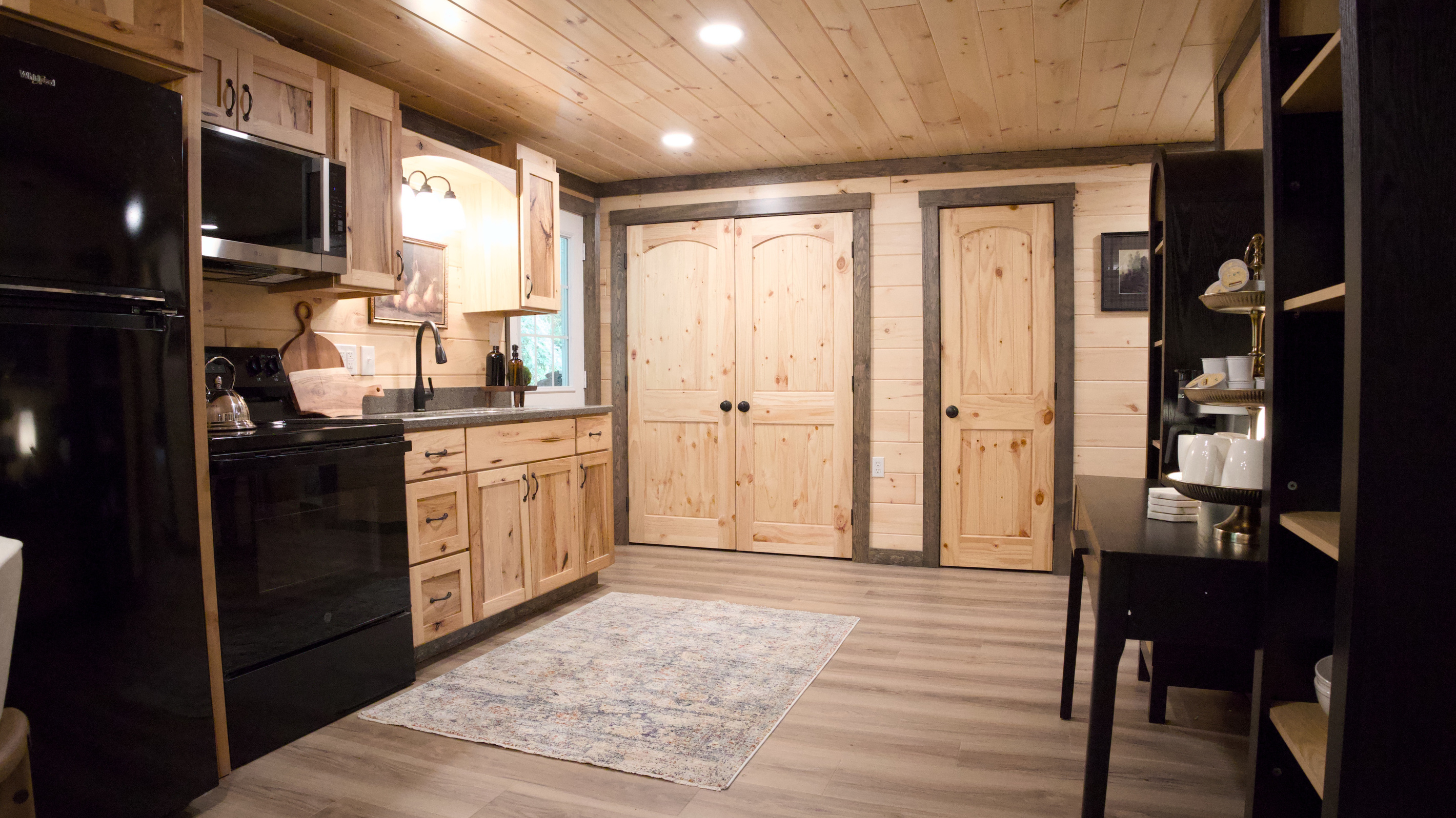Kitchen. Full Stove, Refrigerator and Well Stocked. Laundry is inside the double doors, for your use
