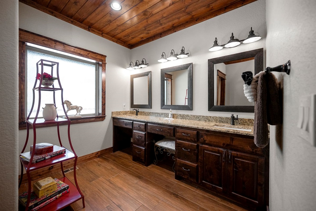 Primary bathroom has double sinks and vanity area