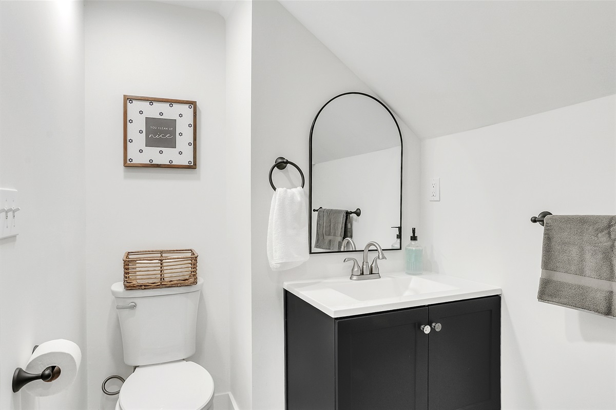 Bright and charming, the bathroom offers a clean, comfortable space to refresh and unwind.