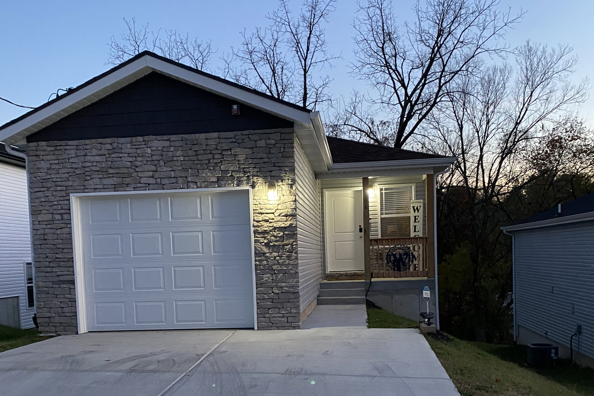 well lit entrance with additional security landscape lights