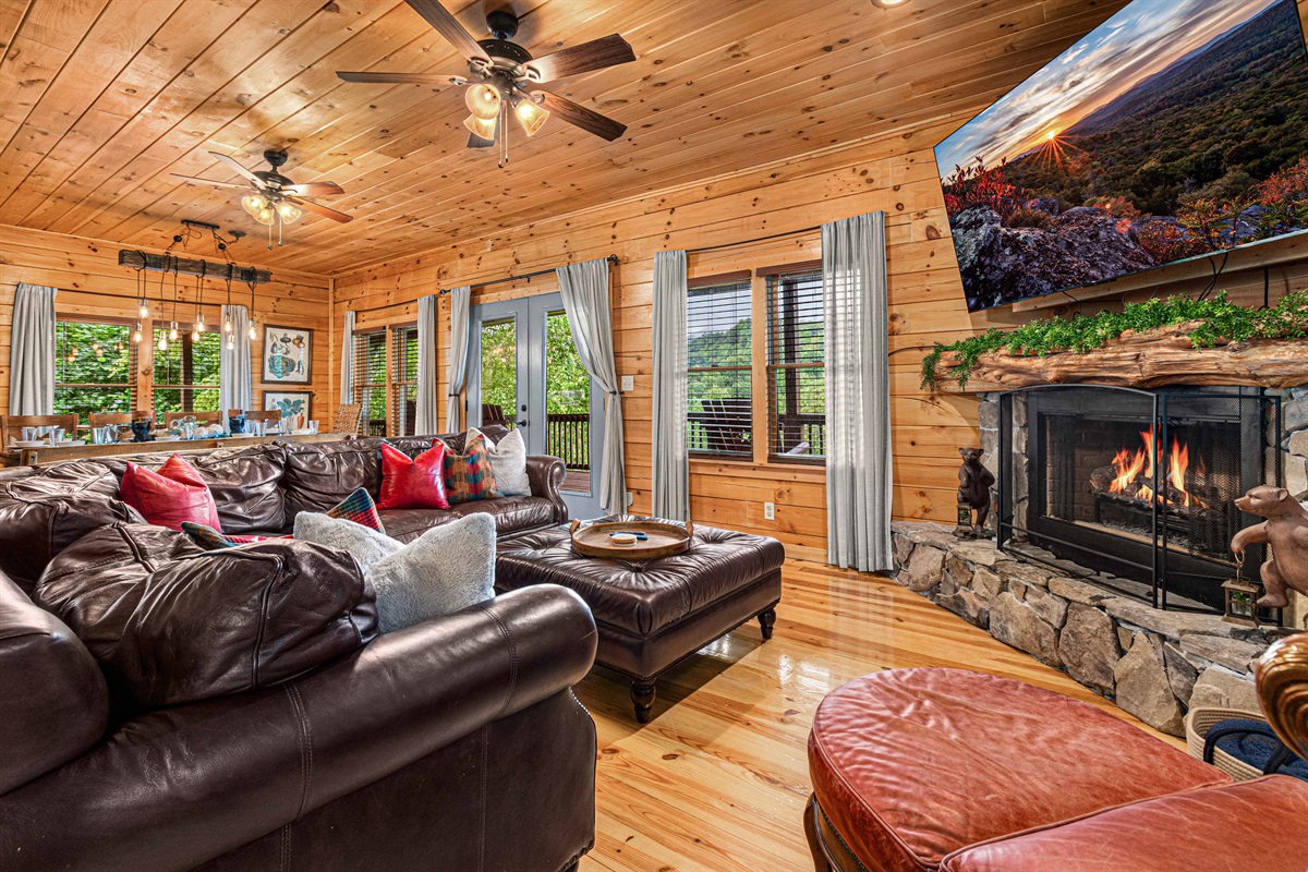 Imagine yourself relaxing on this comfy sectional, enjoying the warmth of the fireplace and the stunning views.