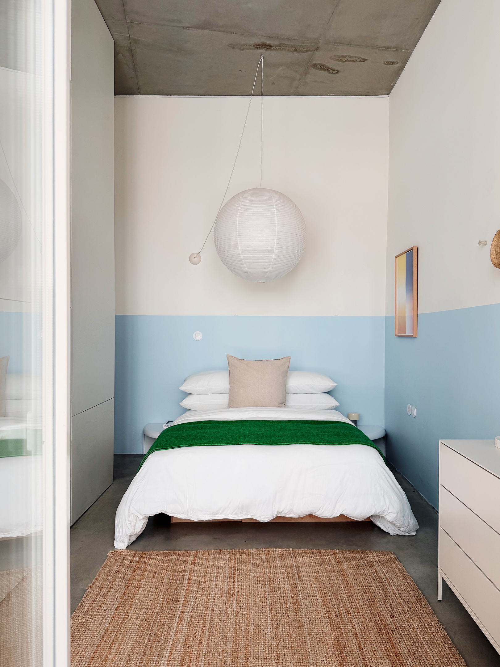 Bed with hybrid mattress and full dresser.