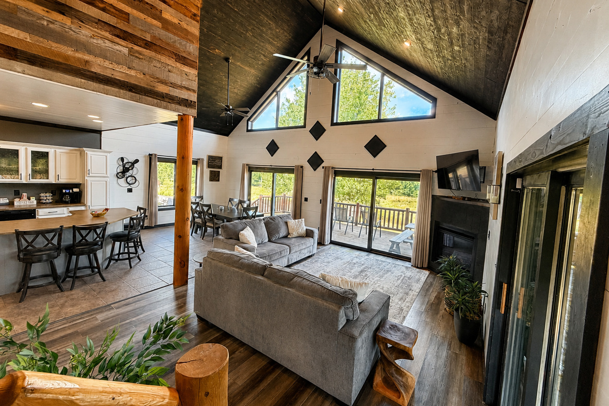 Soaring wood ceilings, a fireplace and comfortable seating make this spacious great room a natural gathering place for your crew.
