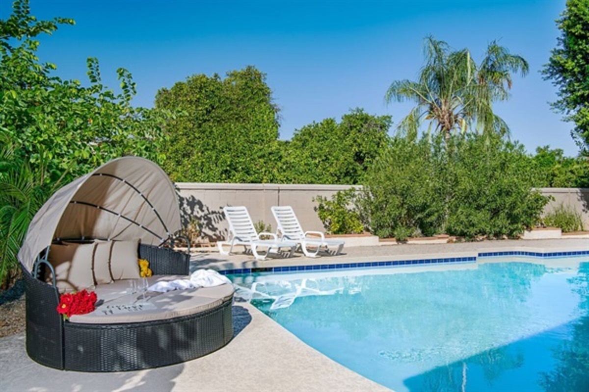 Soak up the sun or slip into the heated pool for a relaxing retreat surrounded by lush privacy and resort-style comfort.
