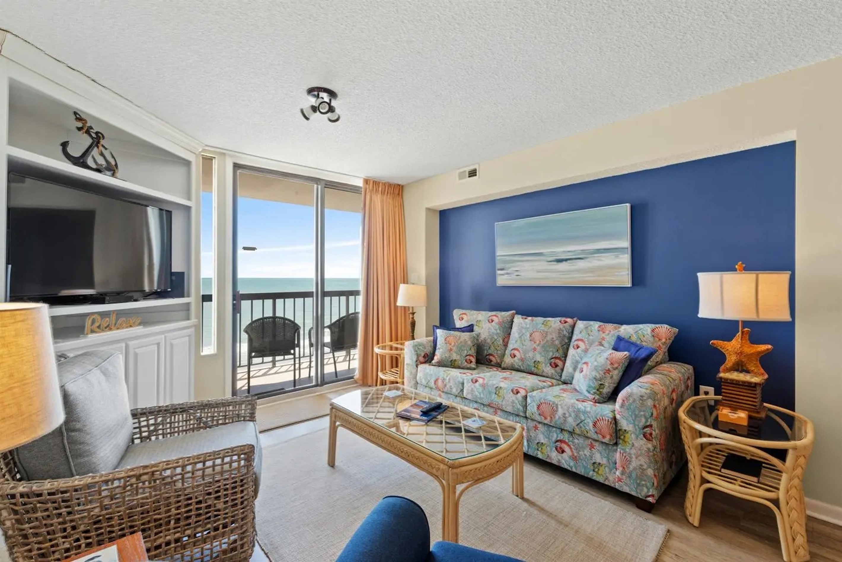 Oceanfront Living room with balcony access