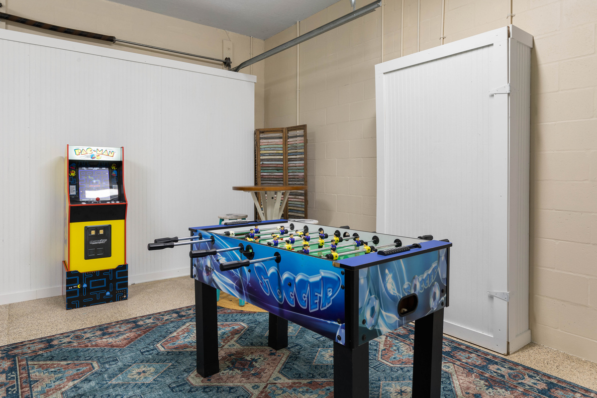 Foosball and a classic Pac-Man cabinet in the game room, so kids and grown-ups can trade high scores all week.