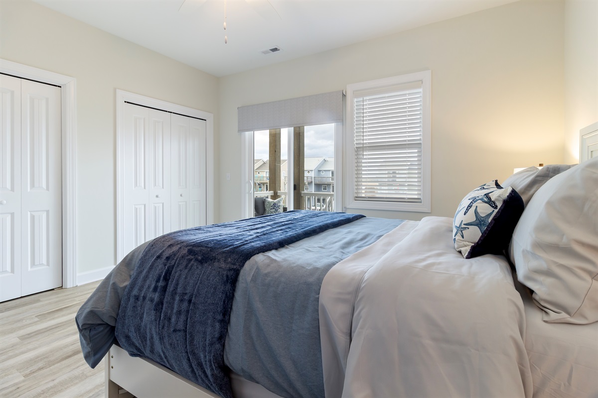 Bedroom 1 - Master with queen bed, ensuite bathroom, and private balcony