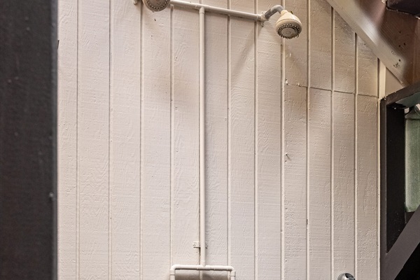 Outdoor shower to rise off sand