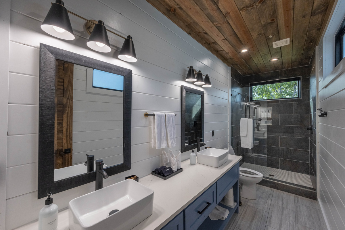 Enjoy spa-like experience in our modern bathroom featuring a spacious double vanity, stylish finishes and thoughtful amenities for your comfort and convenience