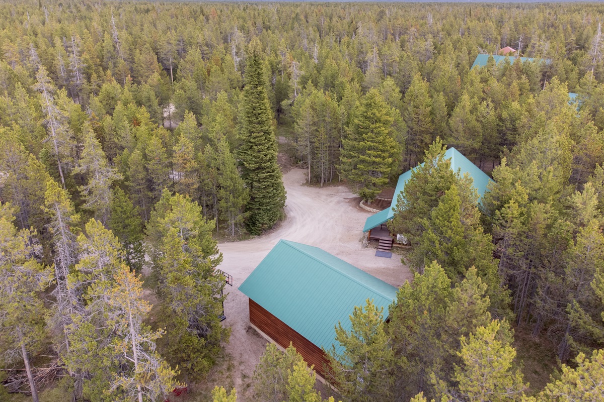 Cabin and Garage tucked away in the lodge pole and fur trees