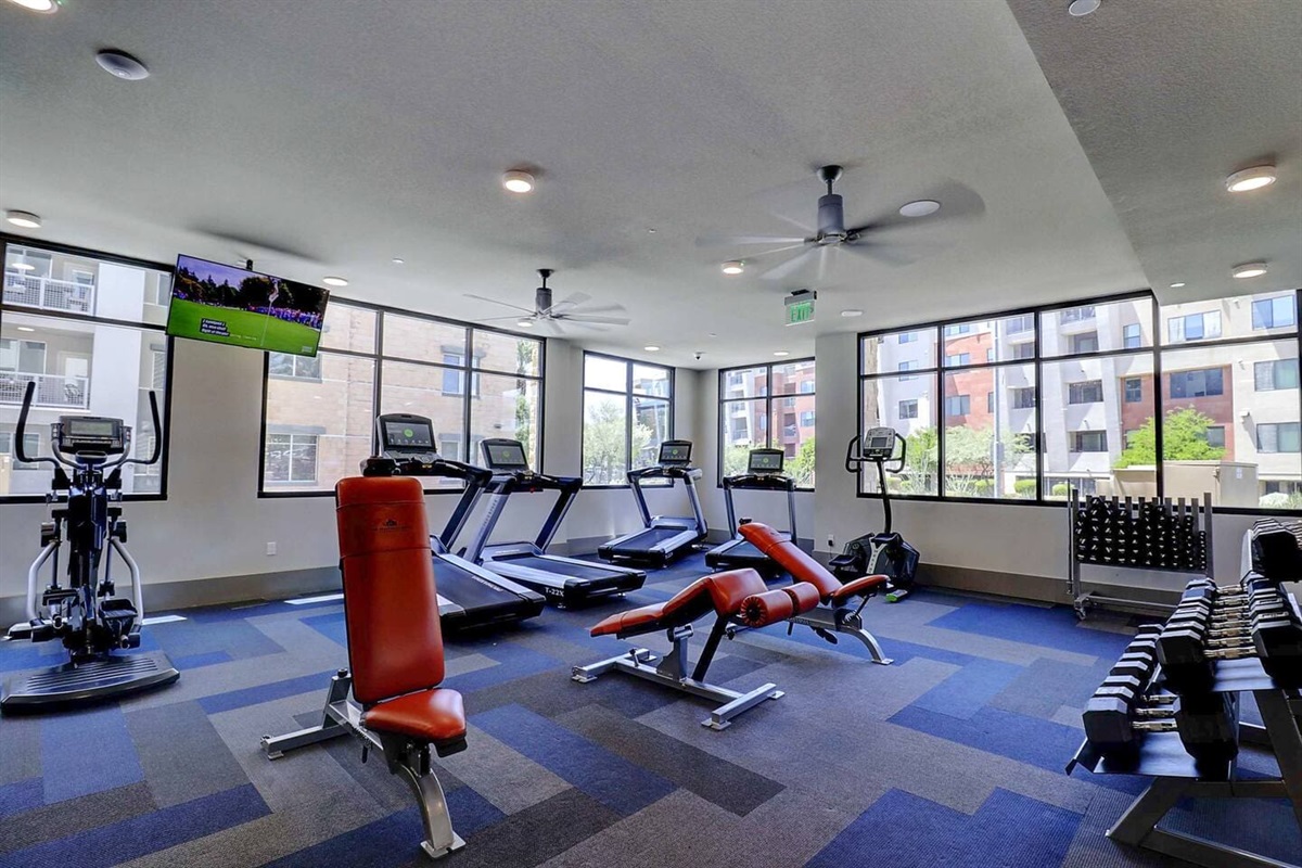 - Keep your fitness goals strong in a fully equipped gym with cardio machines   - Enjoy natural light, modern floors, and a motivating workout environment   - Includes treadmills, free weights, and benches for every fitness routine