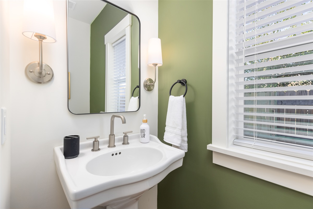 The half bathroom downstairs is convenient to the living room, kitchen, and dining room.