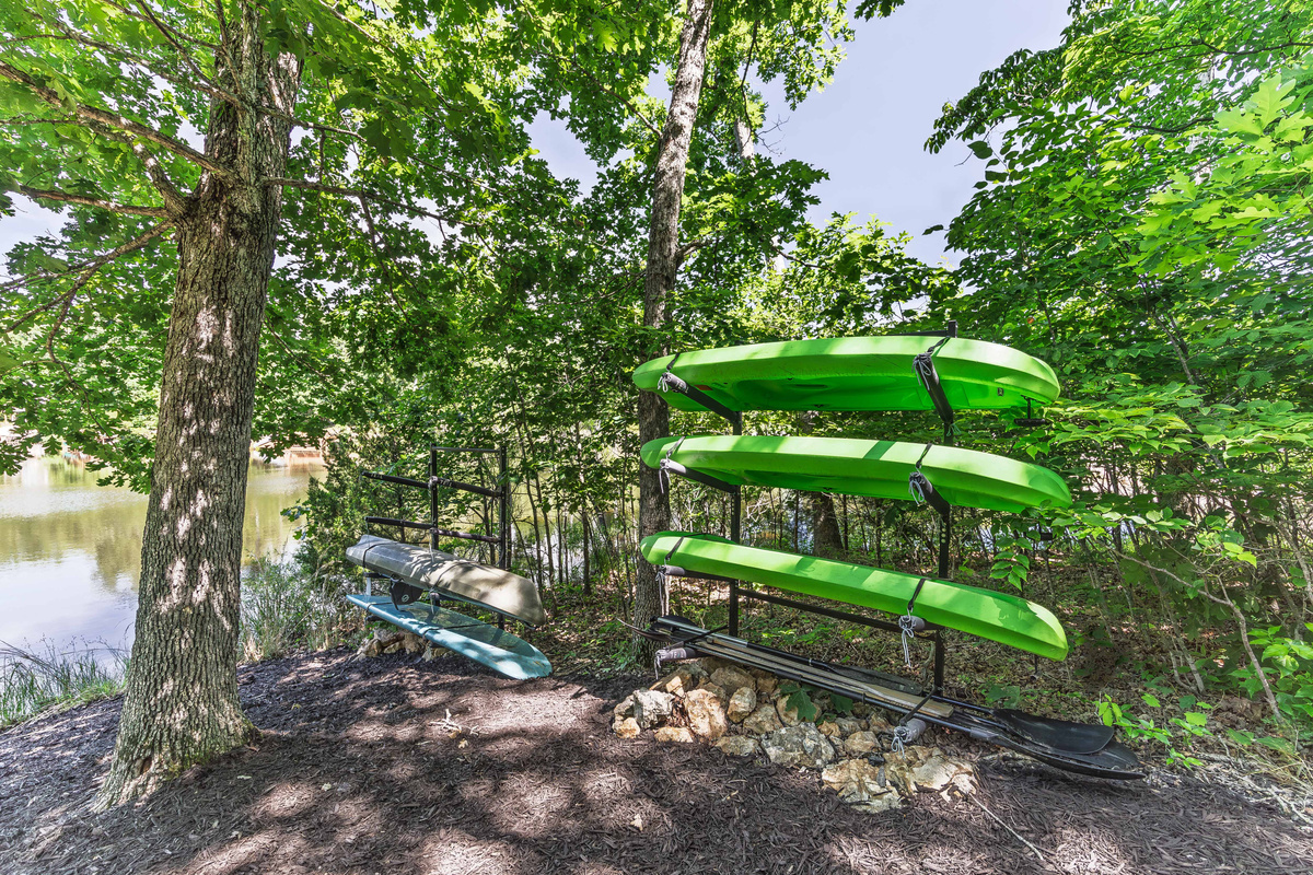 Kayaks and a standup paddleboard are included for exploring the lake.