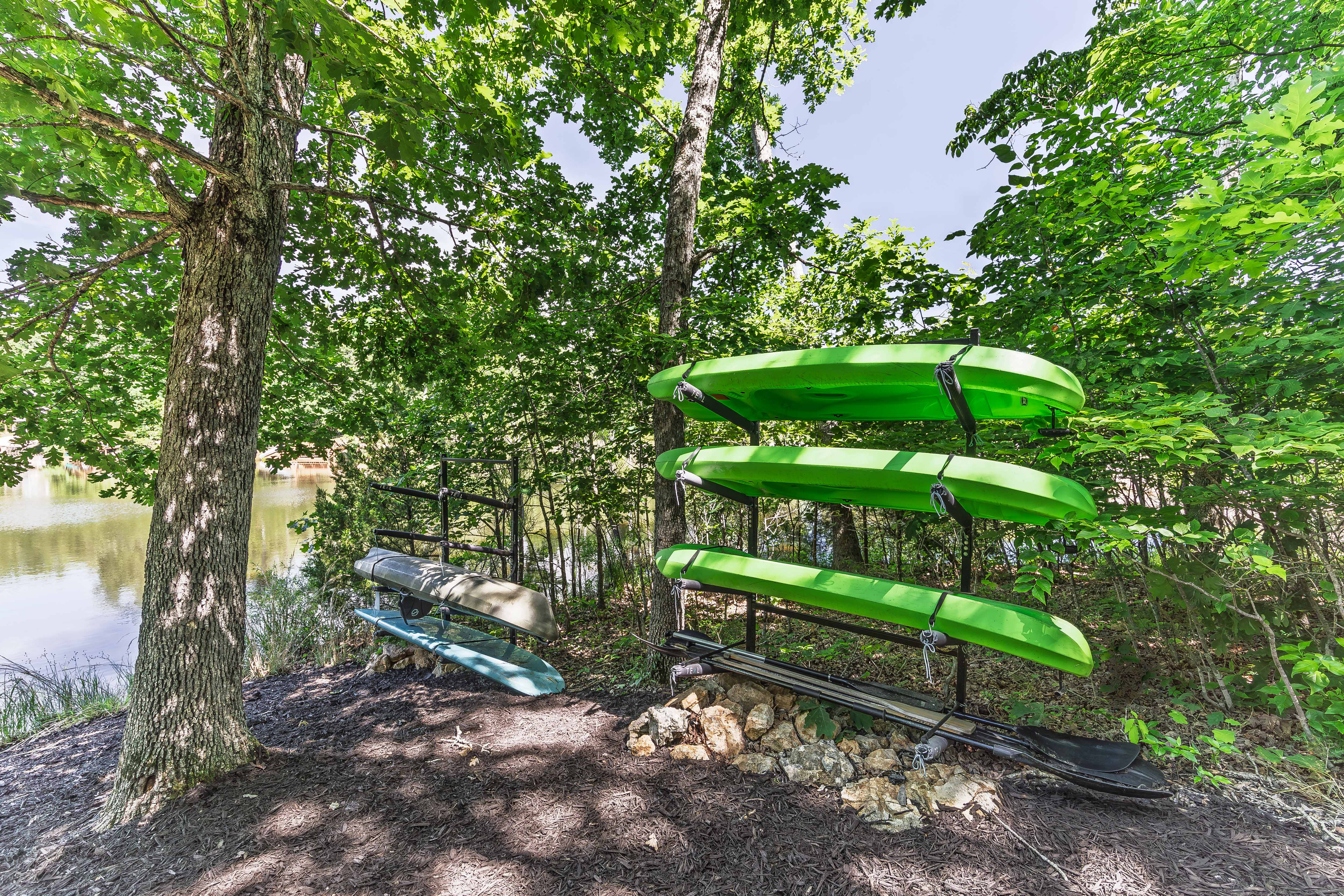 Kayaks and a standup paddleboard are included for exploring the lake.