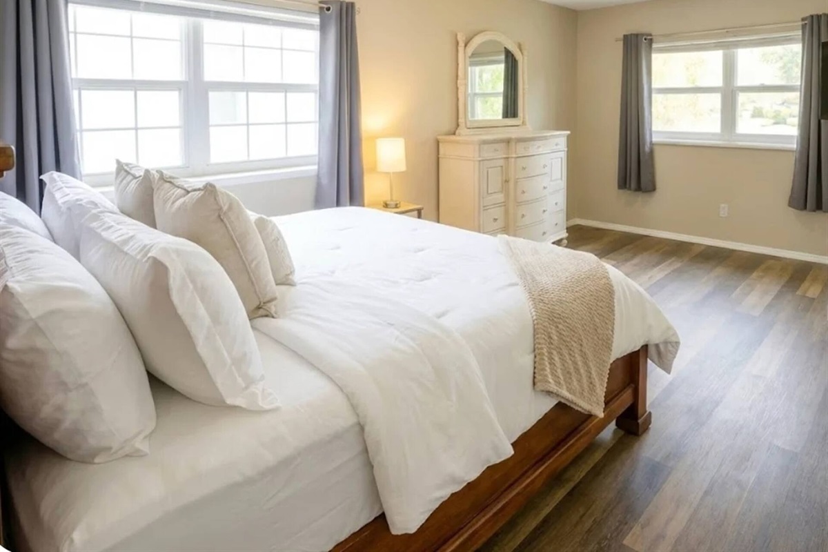 Bedroom 1 - Bright and airy master bedroom with multiple windows and attached ensuite