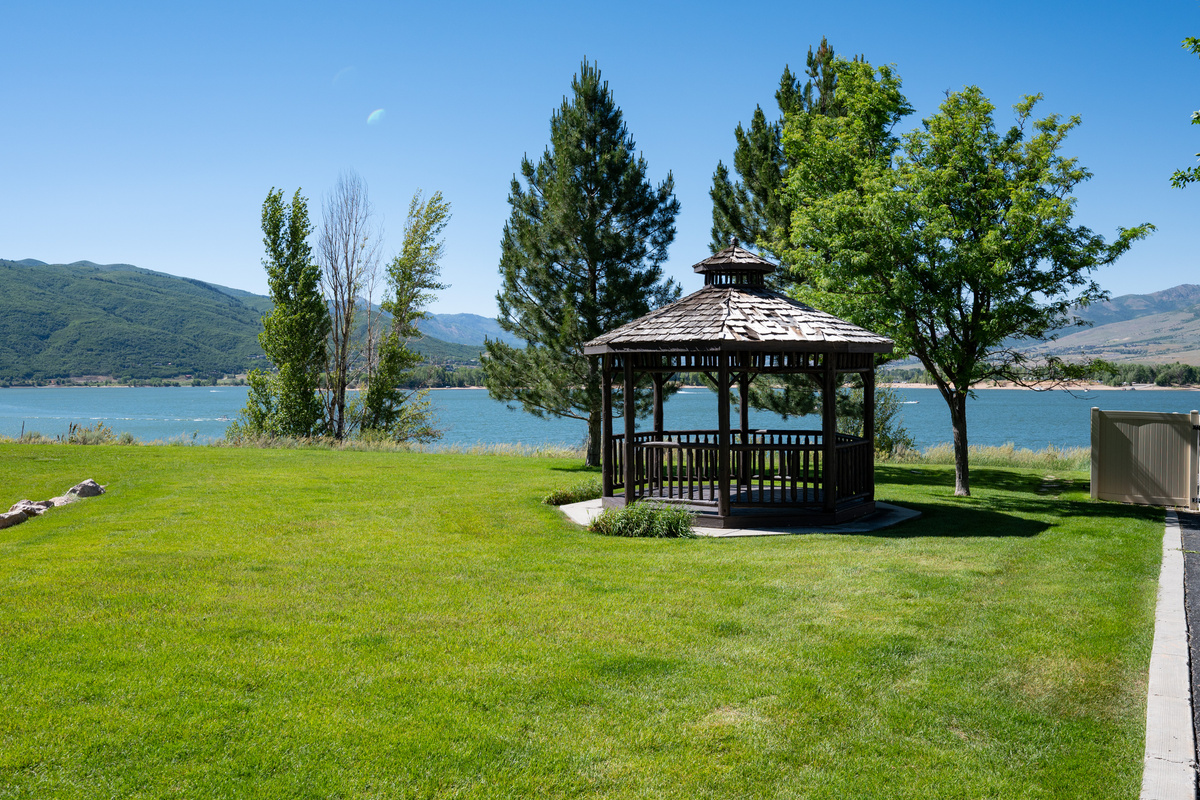 Community gazebo and waterfront green space provide a peaceful lakeside setting.