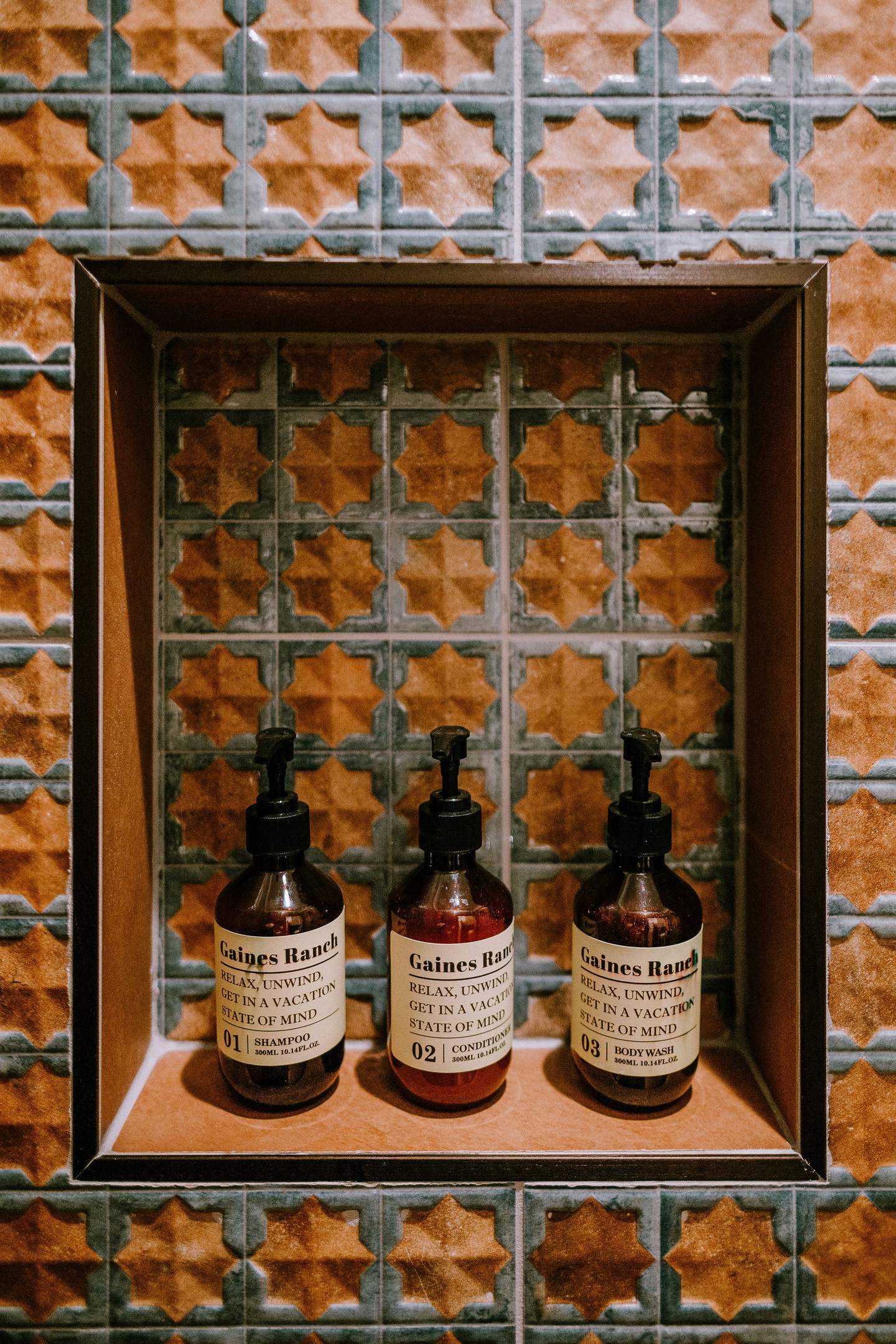 Curated Gaines Ranch on the Square bath amenities — body lotion, hand wash, and bath essentials in every suite, including Cutter's Quarters.