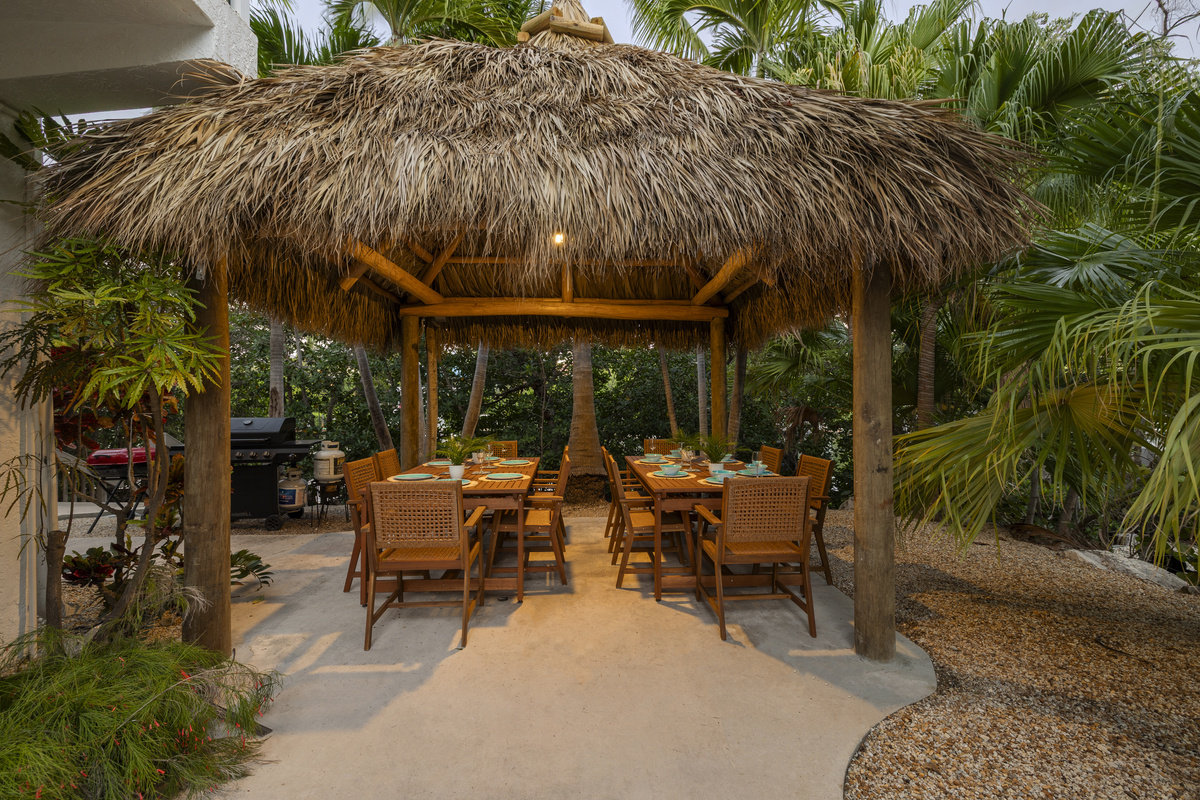 The first of two outdoor tiki huts, this one is set up for your entire family to dine outside, with space to seat 12.