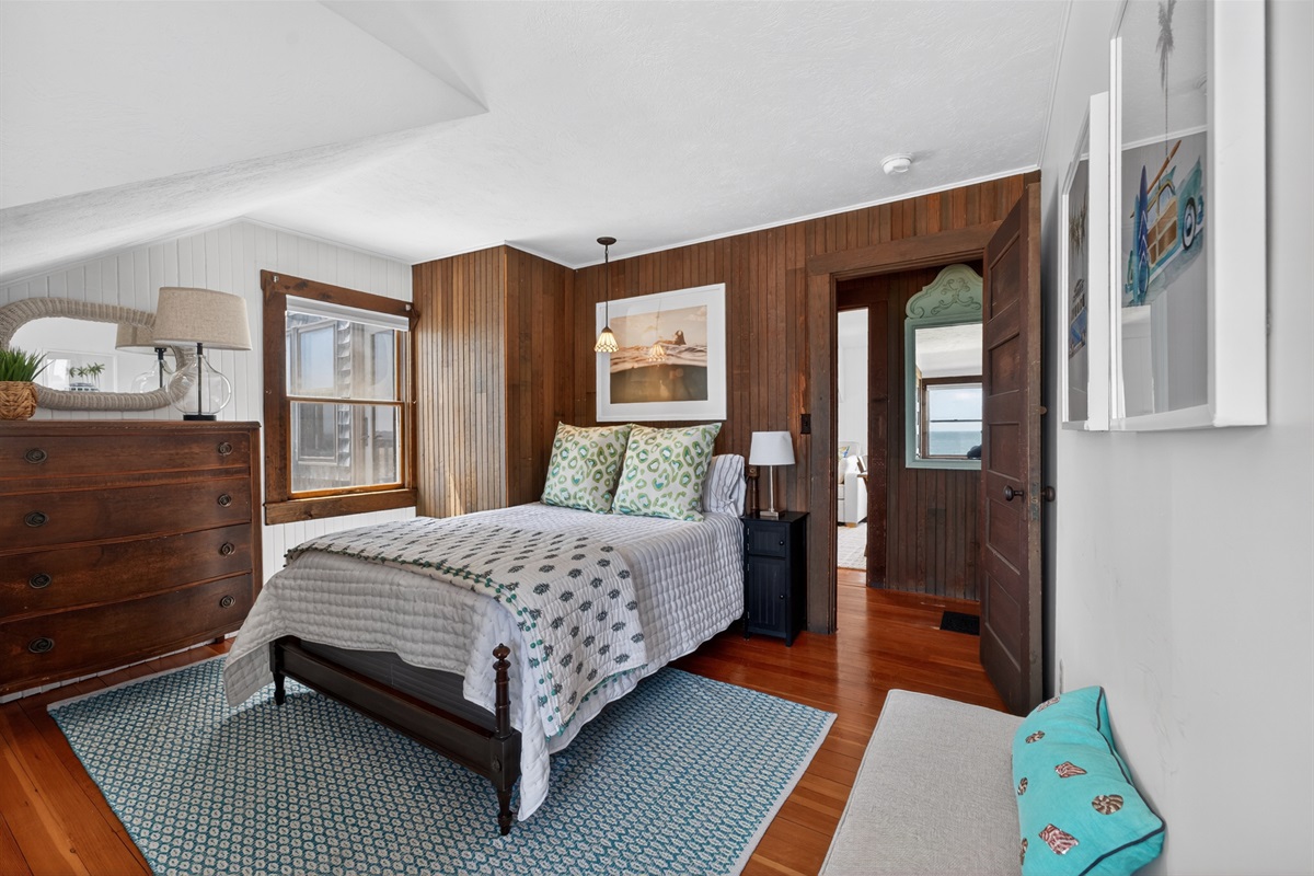 Welcome to our second bedroom! 
Relax in this charming oceanfront bedroom with a cozy full bed and water views!