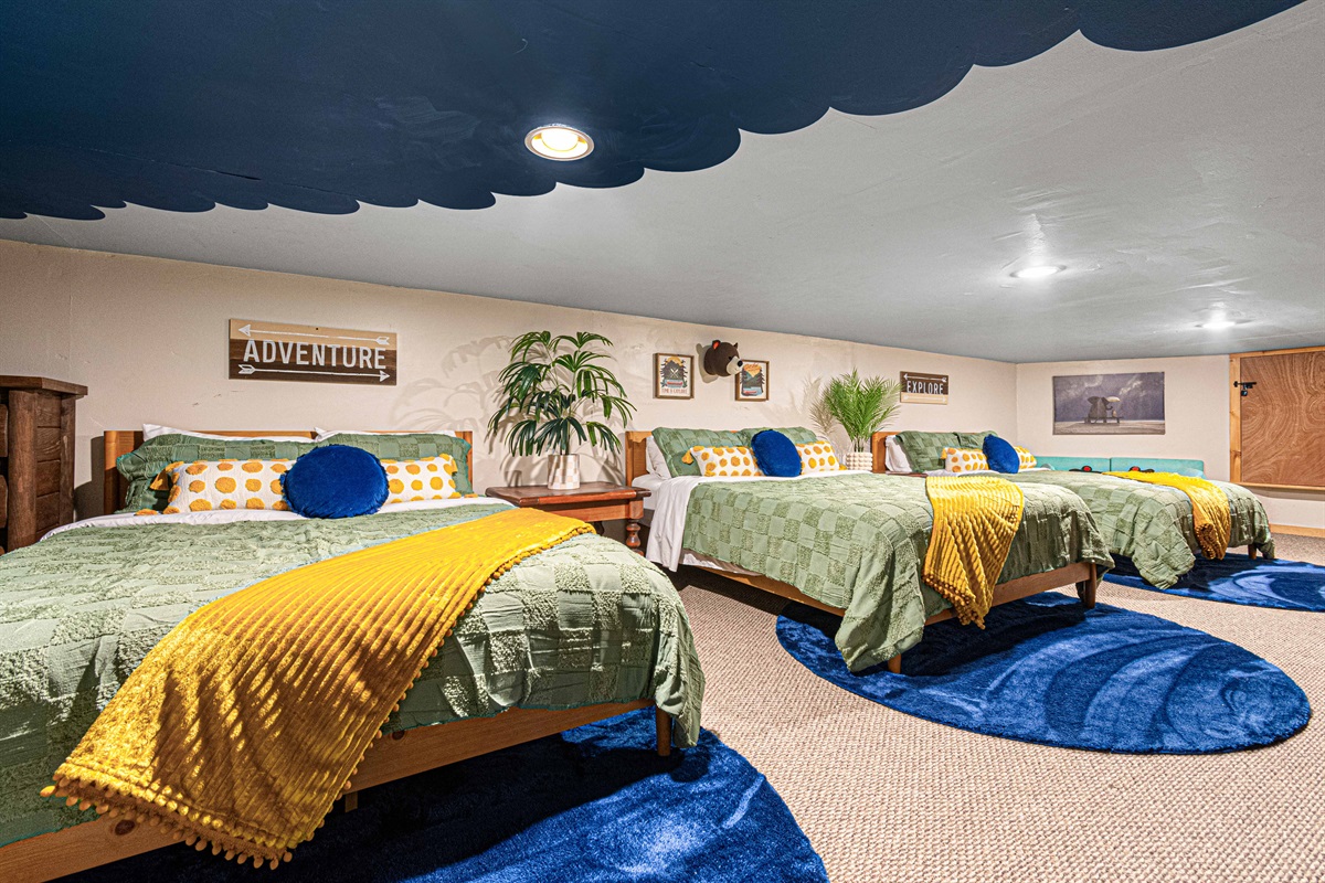 Cloud Nine Comfort: Drift off to sleep in this dreamy bedroom with multiple beds.