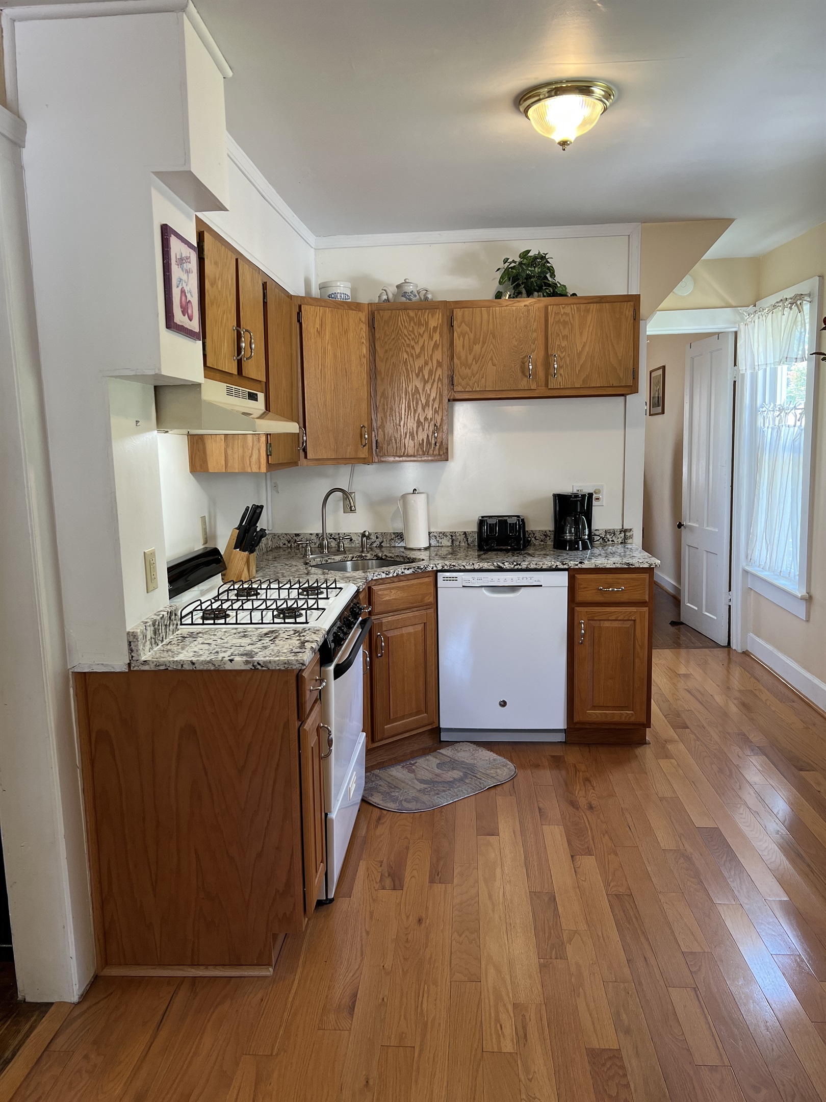 Kitchen with hall to Queen #2 beyond