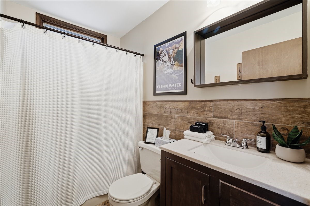 Downstairs full bath keeps mornings running smoothly! Fresh, clean and ready for your whole group
