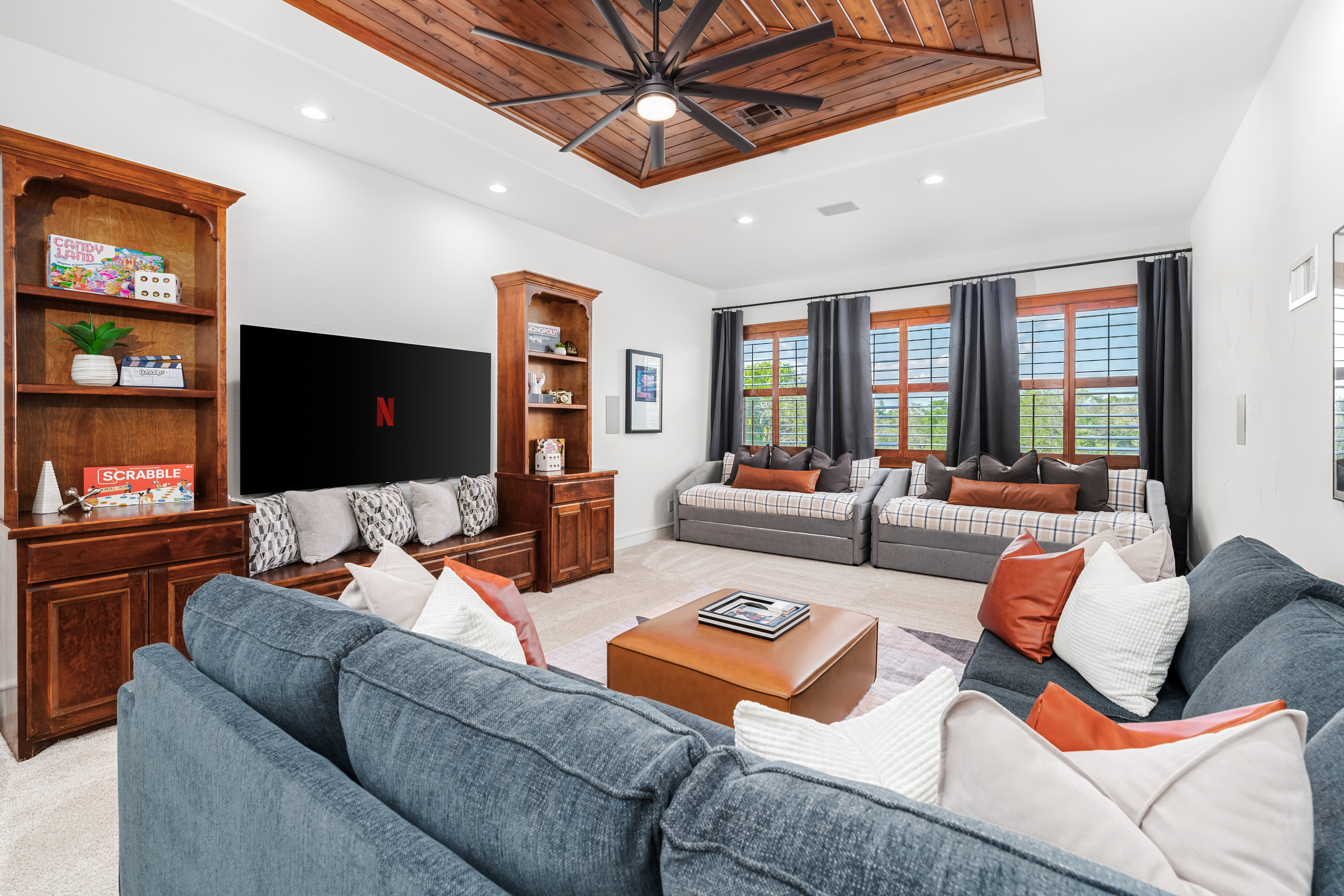 A versatile upstairs space with a sofa bed and two twin trundle beds—perfect for relaxing or accommodating extra guests.