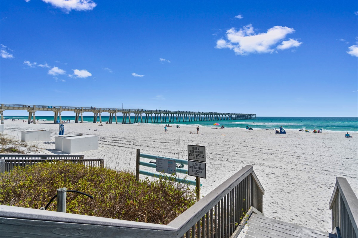 A convenient beach access boardwalk leads directly from the property to the sugar-white sand below.