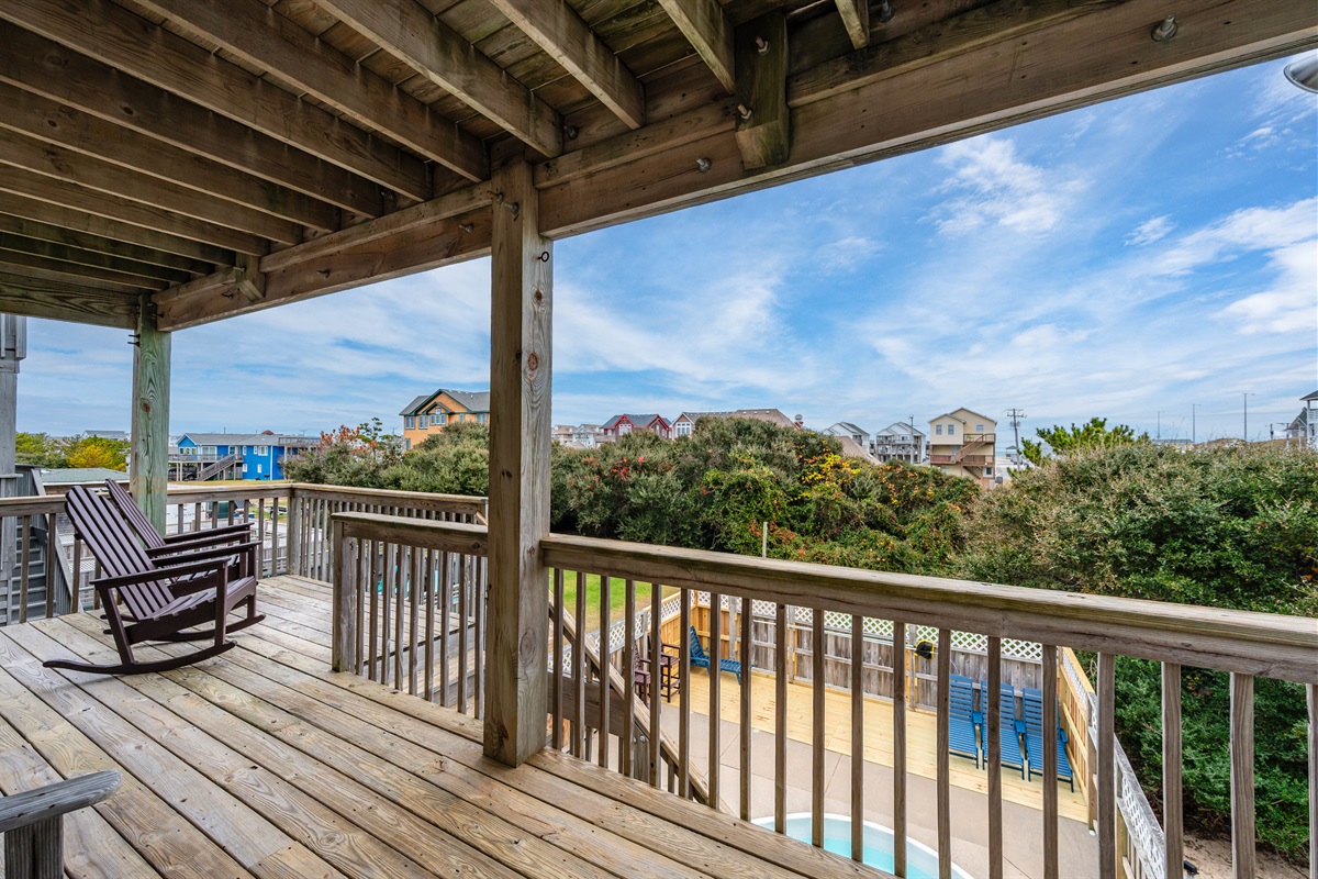 Shaded outdoor seating with peaceful views.