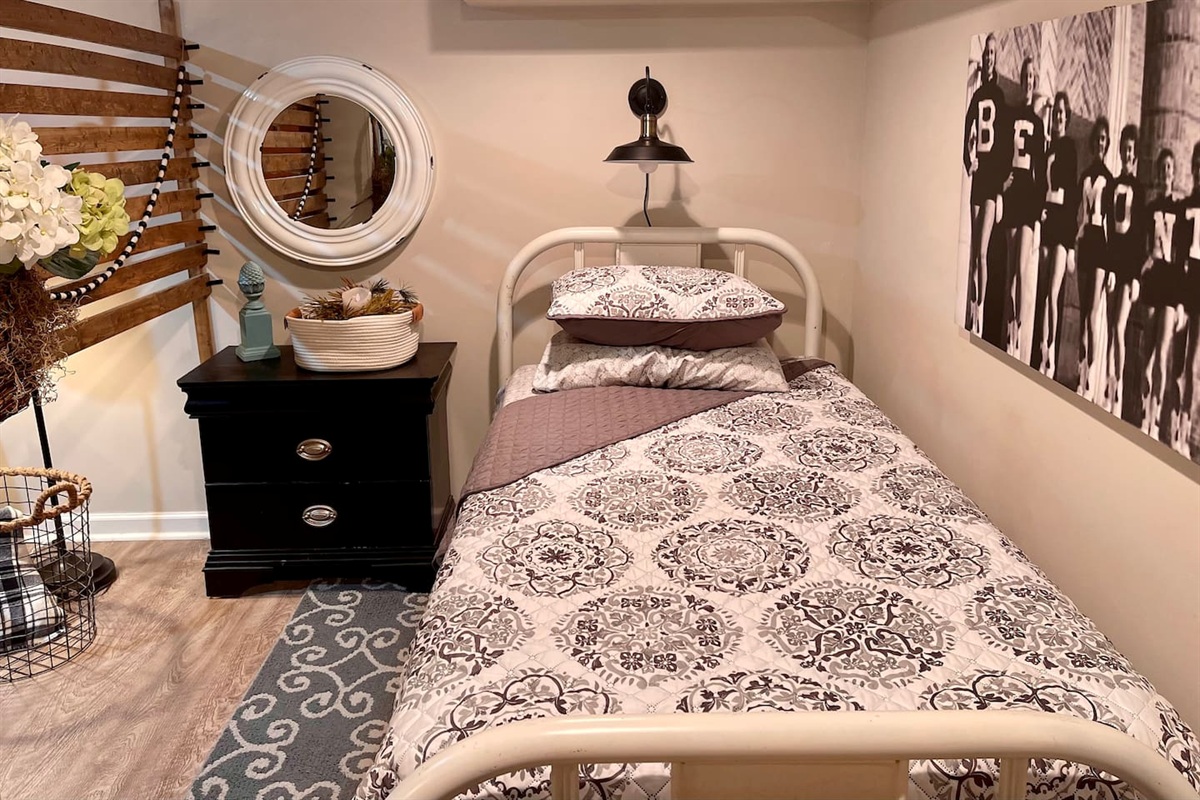 Precious twin area with an antique single bed with memory foam mattress.